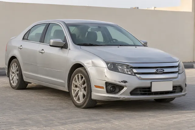 Used sedan with modest bumper damage, ready for vehicle assessment